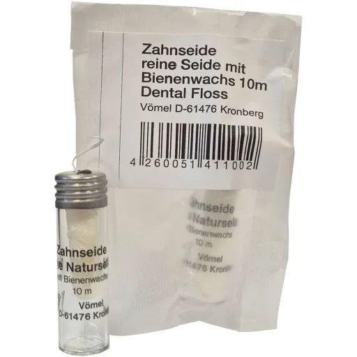 Zahnseide im Glasflacon